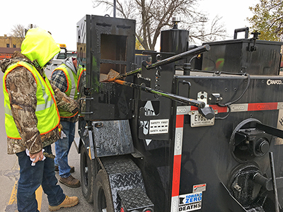 A maintenance crew patches roadway in Willmar